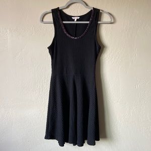 Candie’s beaded black fit and flare mini dress
